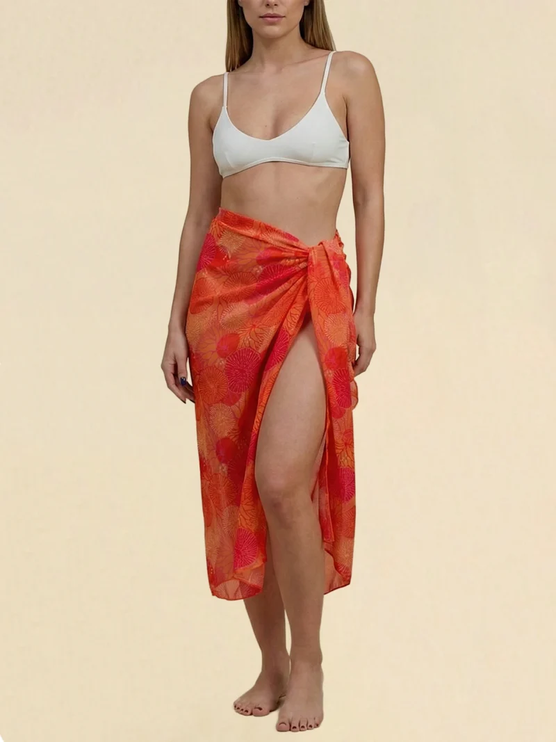 Achinos Orange pareo with a vibrant, textured pattern.