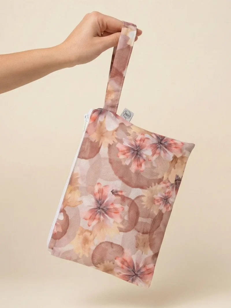 Handbag featuring dandelion pattern in soft natural tones.