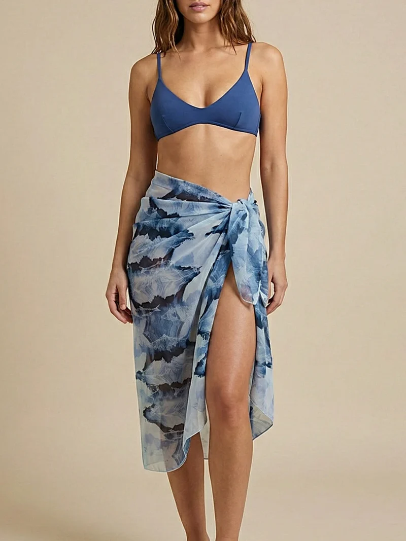 Psaraki pareo featuring a flowing wave-inspired pattern.